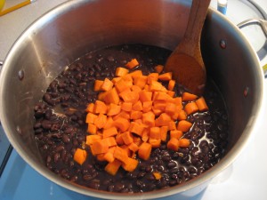 Stirring Carrots into Black Bean Stew