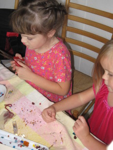 The girls playing with beads