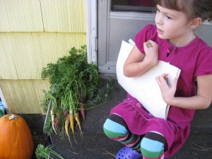 Little Hen with the carrots she dug this morning.